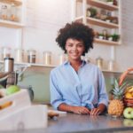 Proud young female juice bar owner