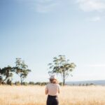 Canva-Woman-standing-in-the-middle-of-the-farm-field-1920.jpg